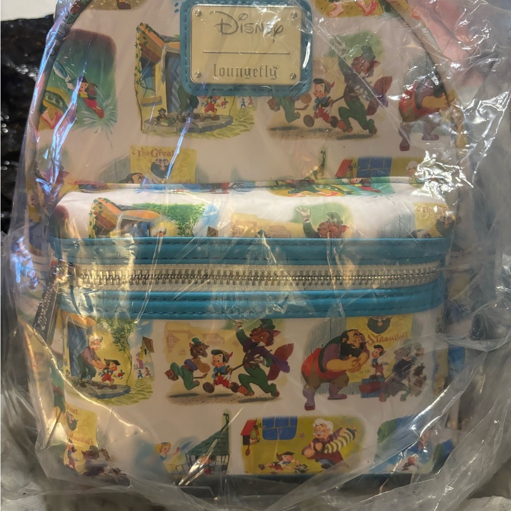 Loungefly Disney Pinocchio Little Golden Book Scenes AOP Mini Backpack